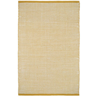 The pattern of this rug is a hand-woven base in a yellow mango color revealing a thick yarn in pure felted wool.