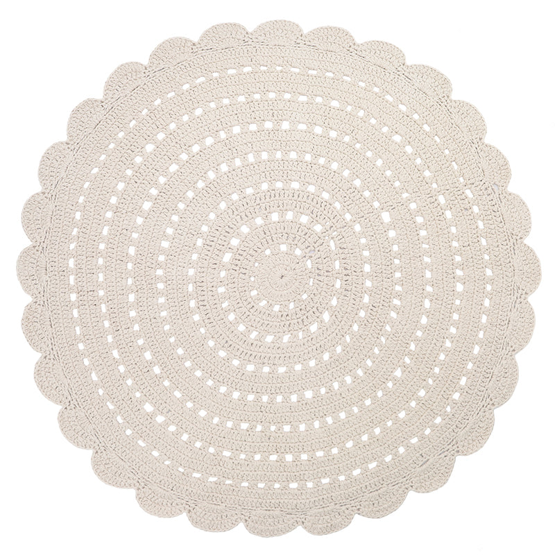 Alma is a round, hand-crocheted rug in a ecu colour. This rug is available in two sizes.