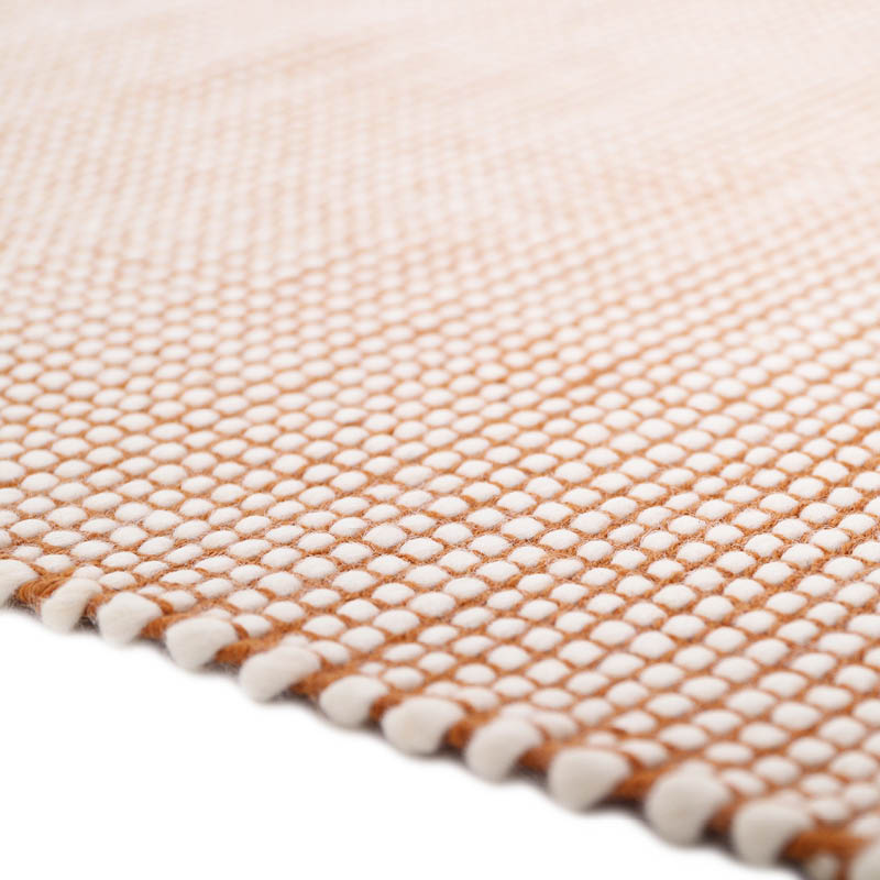 This rug is made in a hard-wearing and easy-care material. A brush and at low power, a clean cloth and soapy water or dry cleaning powder will be perfect to clean this rug.
