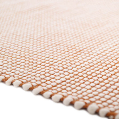 This rug is made in a hard-wearing and easy-care material. A brush and at low power, a clean cloth and soapy water or dry cleaning powder will be perfect to clean this rug.