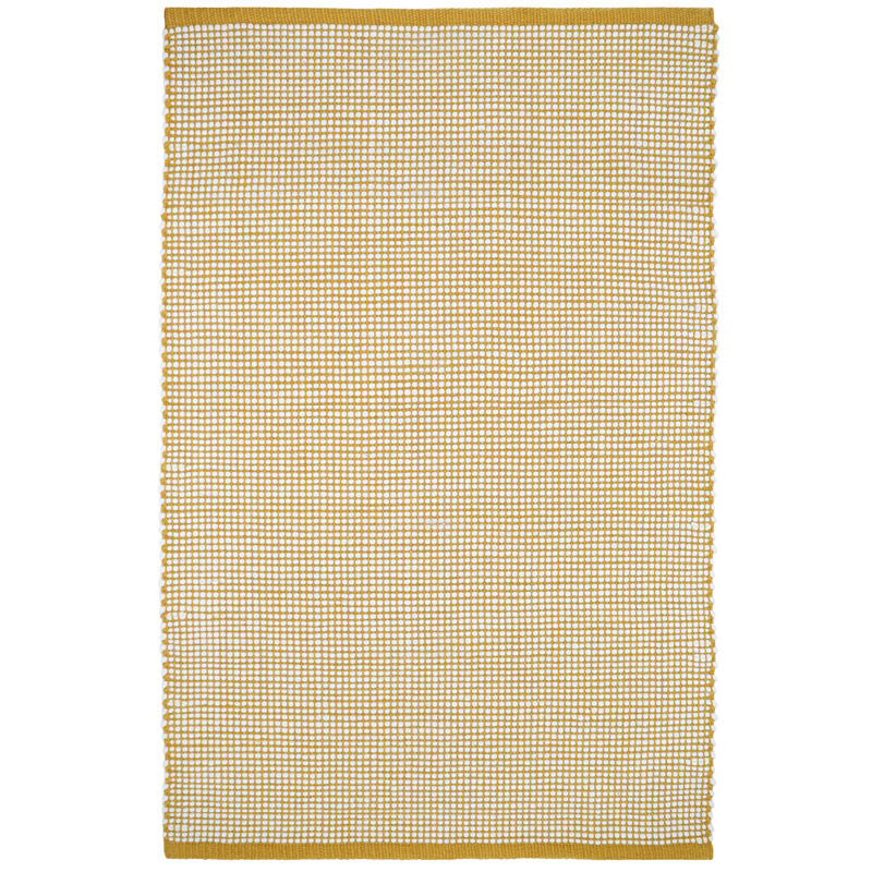 The pattern of this rug is a hand-woven base in a yellow mango color revealing a thick yarn in pure felted wool.
