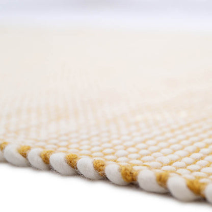 This rug is made in a hard-wearing and easy-care material. A brush and at low power, a clean cloth and soapy water or dry cleaning powder will be perfect to clean this rug.