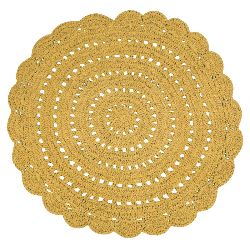 Alma is a round, hand-crocheted rug in a mango colour. Alma is available in 8 colors and can easily fit your interior.