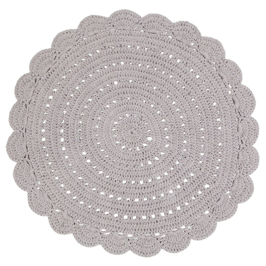 Alma is a round, hand-crocheted rug in a linen colour. Alma is available in 8 colors and can easily fit your interior.